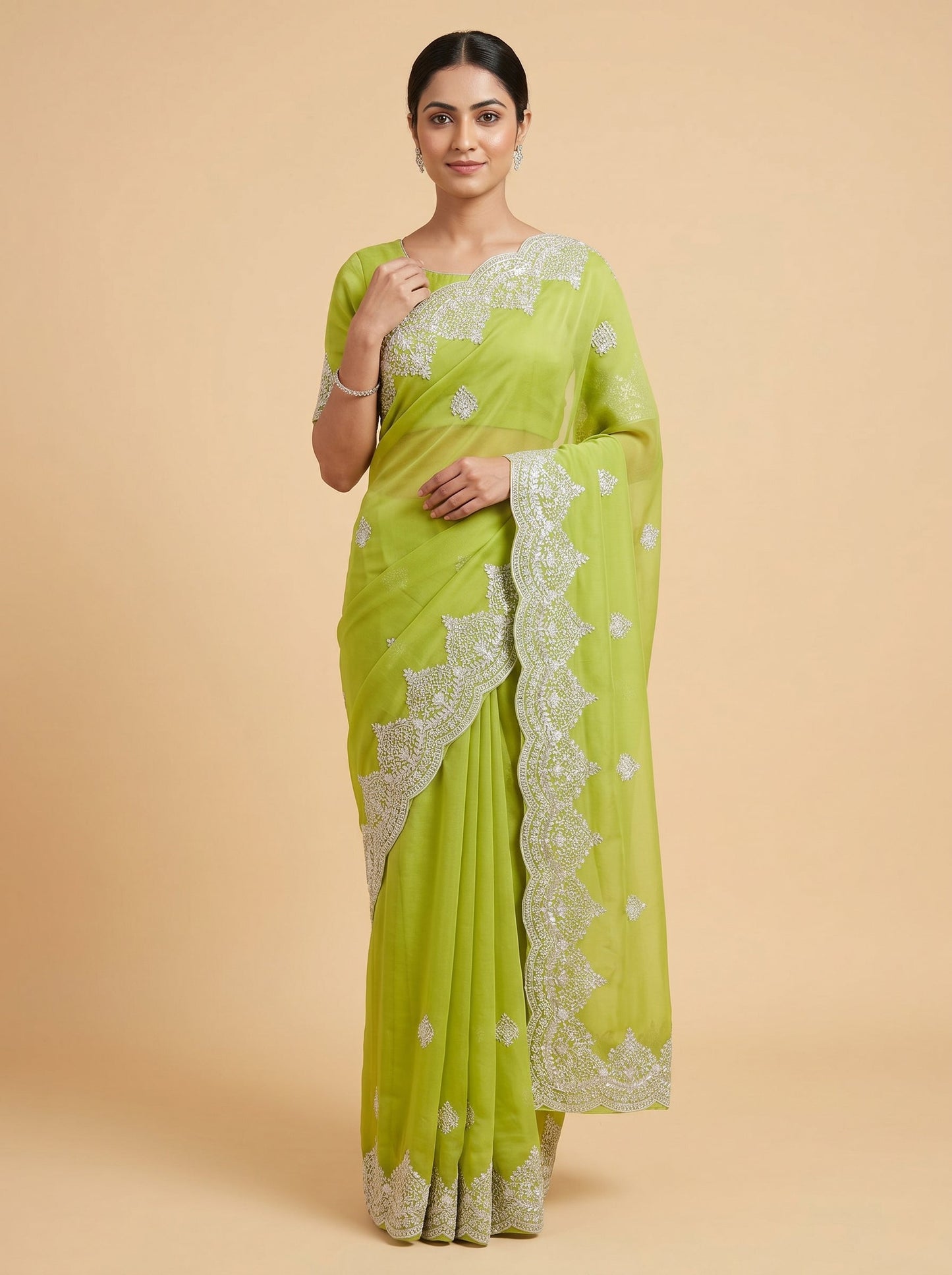 Green embroidered saree with zari accents
