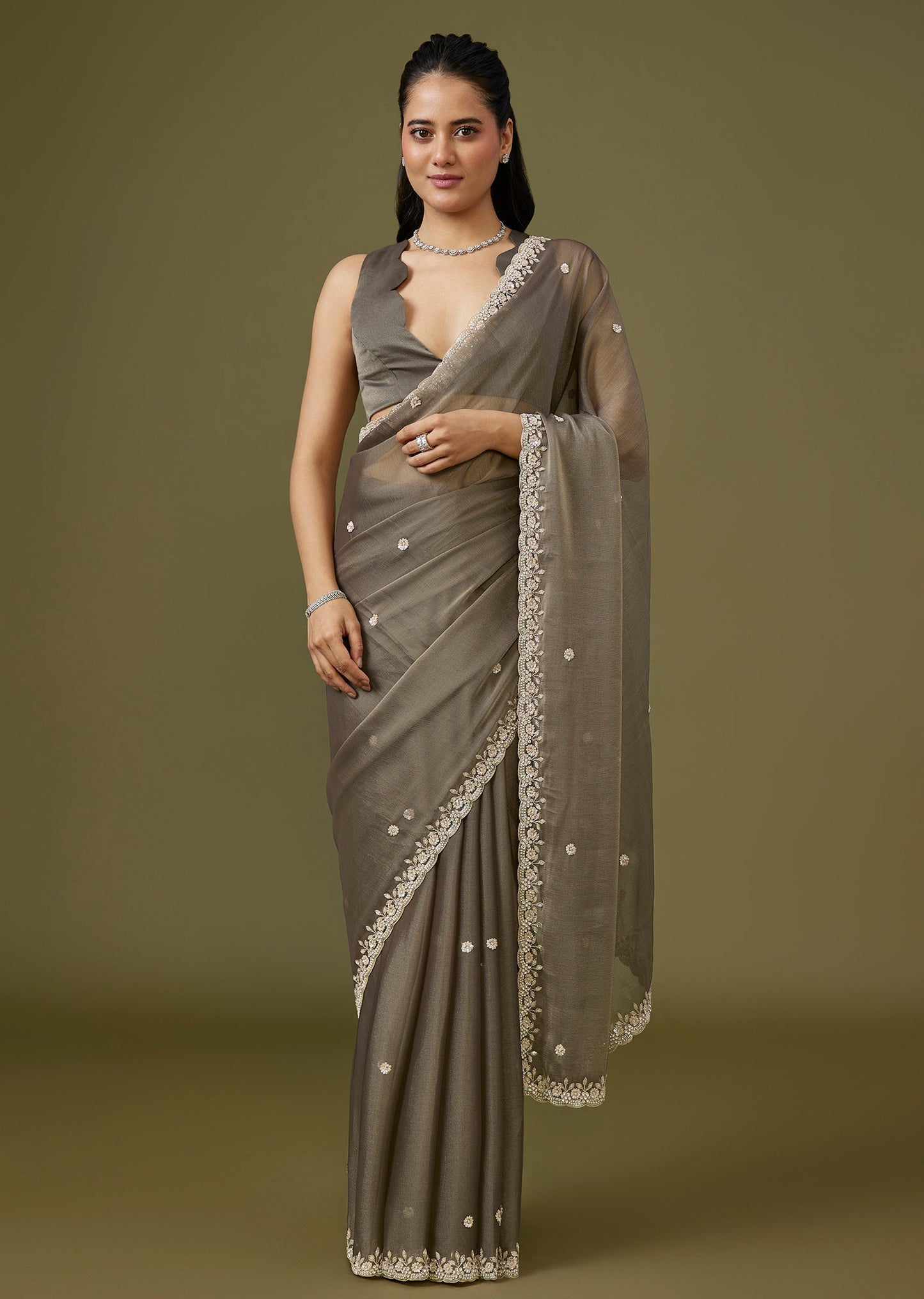 Grey Tissue Saree With Floral Border And Buttis