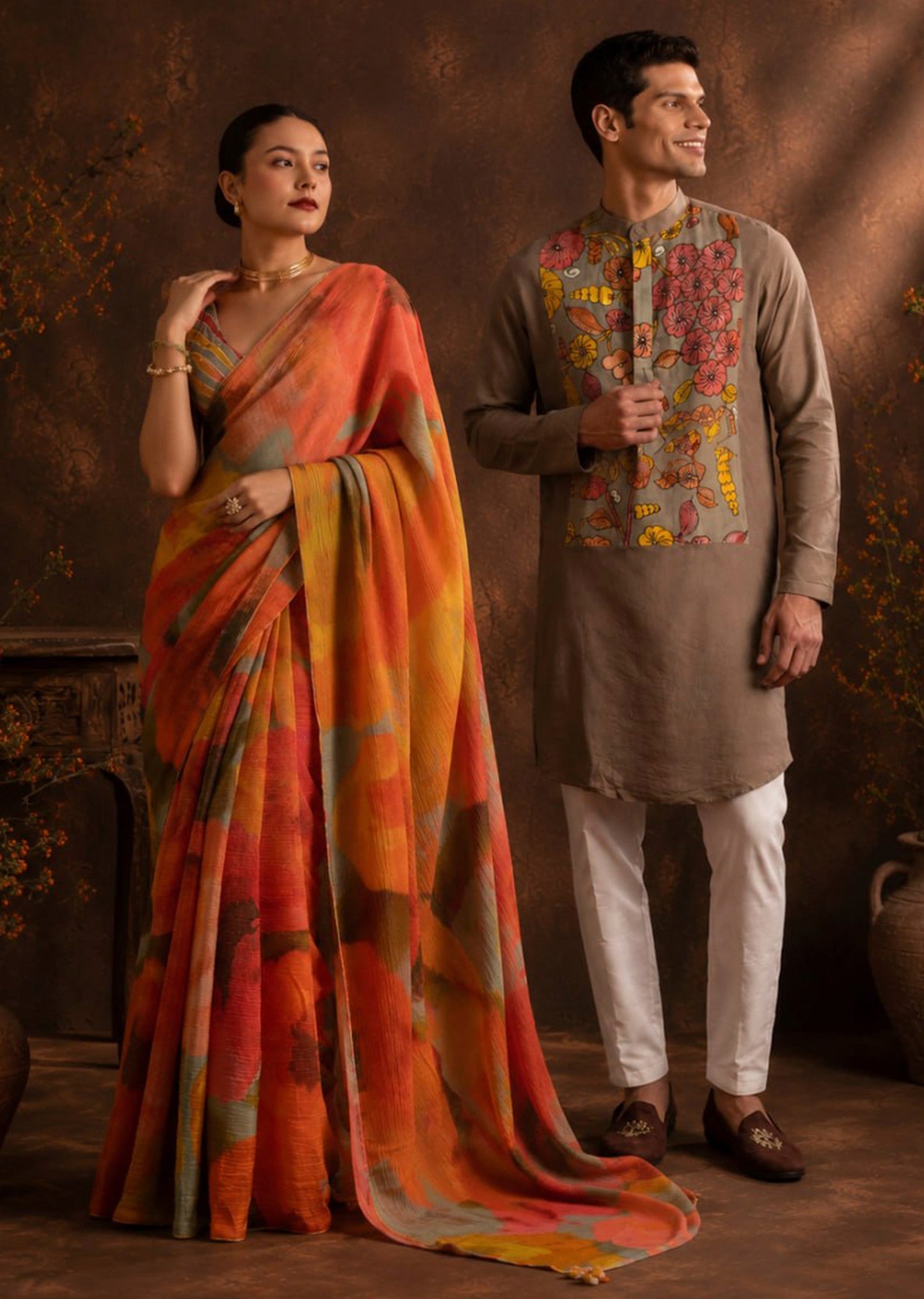 Fusion Couple Set – Orange Abstract Crush Saree for Her & Grey Handpainted Kalamkari Kurta Set for Him