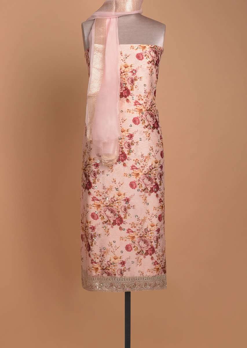 Powder Peach Unstitched Suit With Floral Print And Embellished Buttis